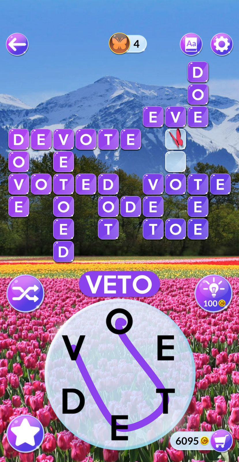 Word puzzle game with mountain and tulip background.