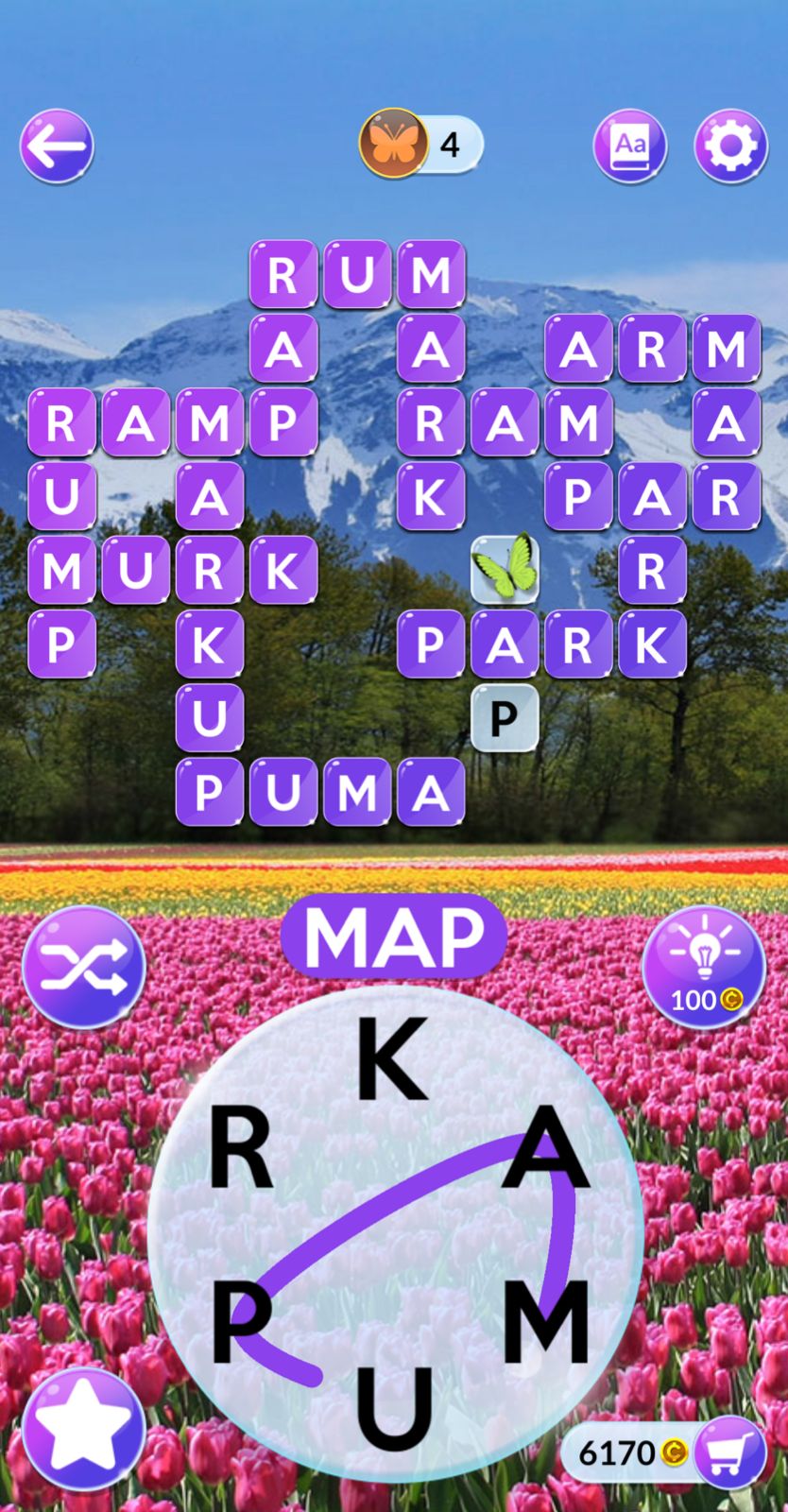Colorful word puzzle game with mountain background.