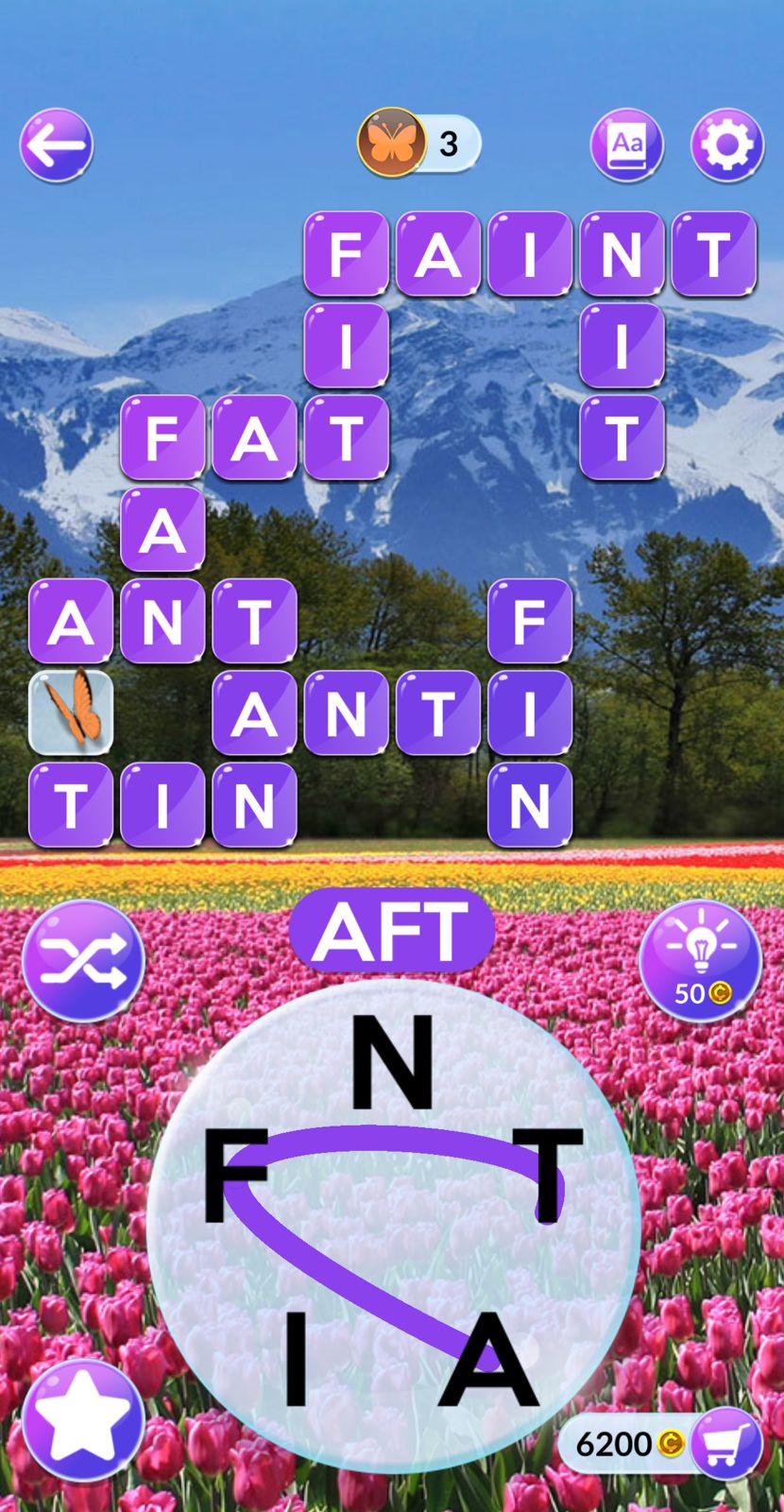 Word puzzle game with mountain and tulip field background.