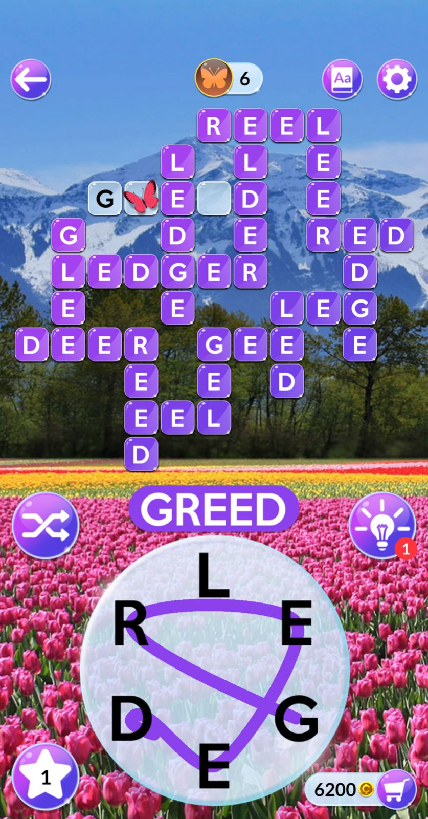 Word puzzle game over scenic mountain background.