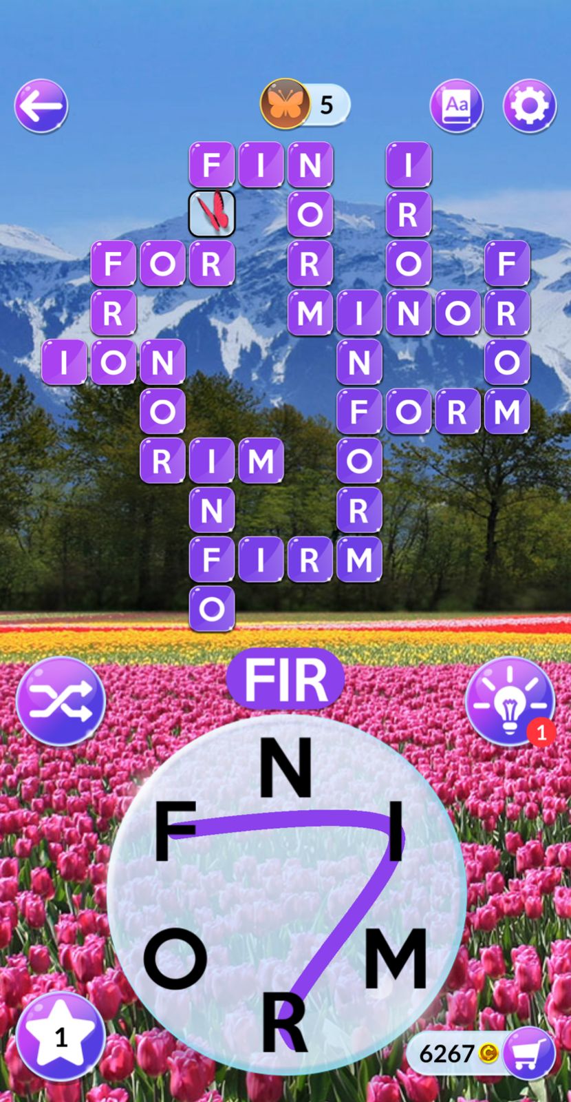 Word puzzle game with mountain and tulip field.