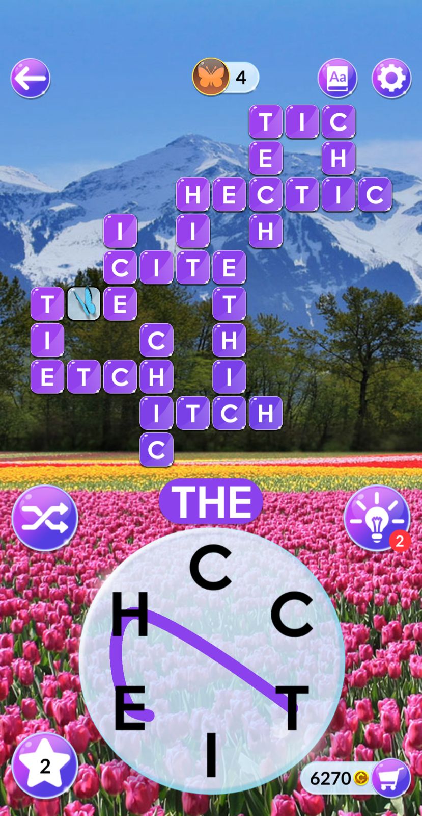 Word game with mountain and tulip background