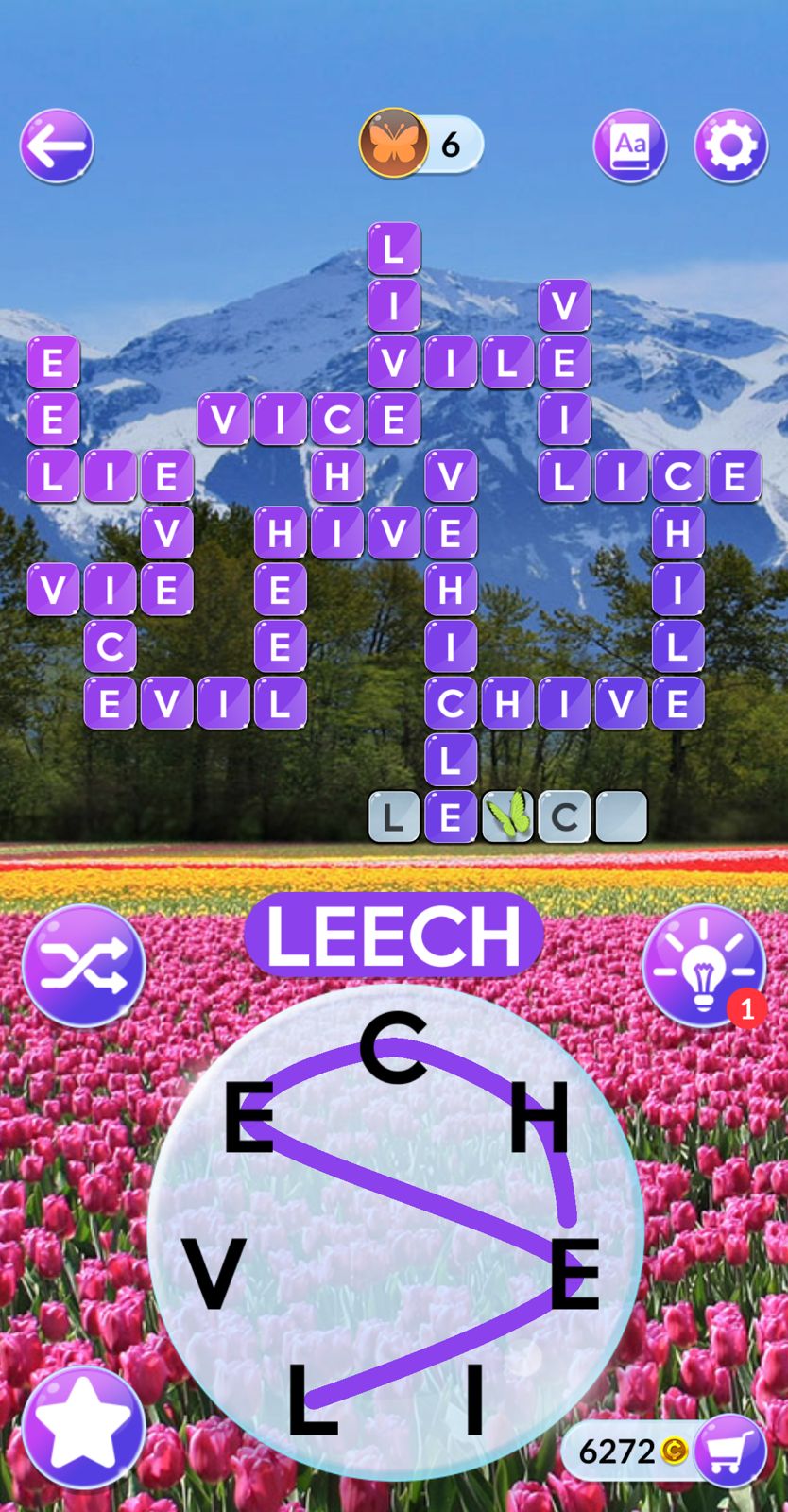 Word puzzle game with mountain and tulip background.