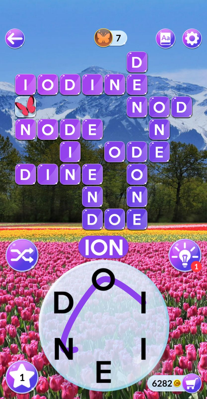 Word puzzle game with mountain and tulip background.