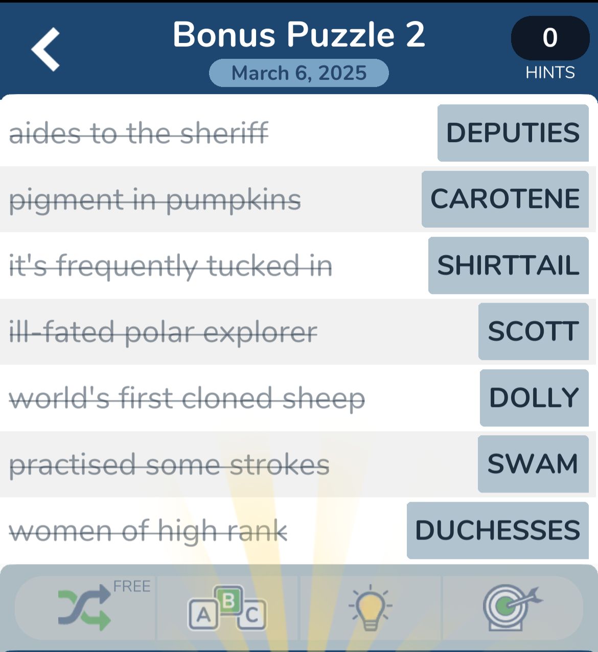 Crossword puzzle clues with answers on screen.